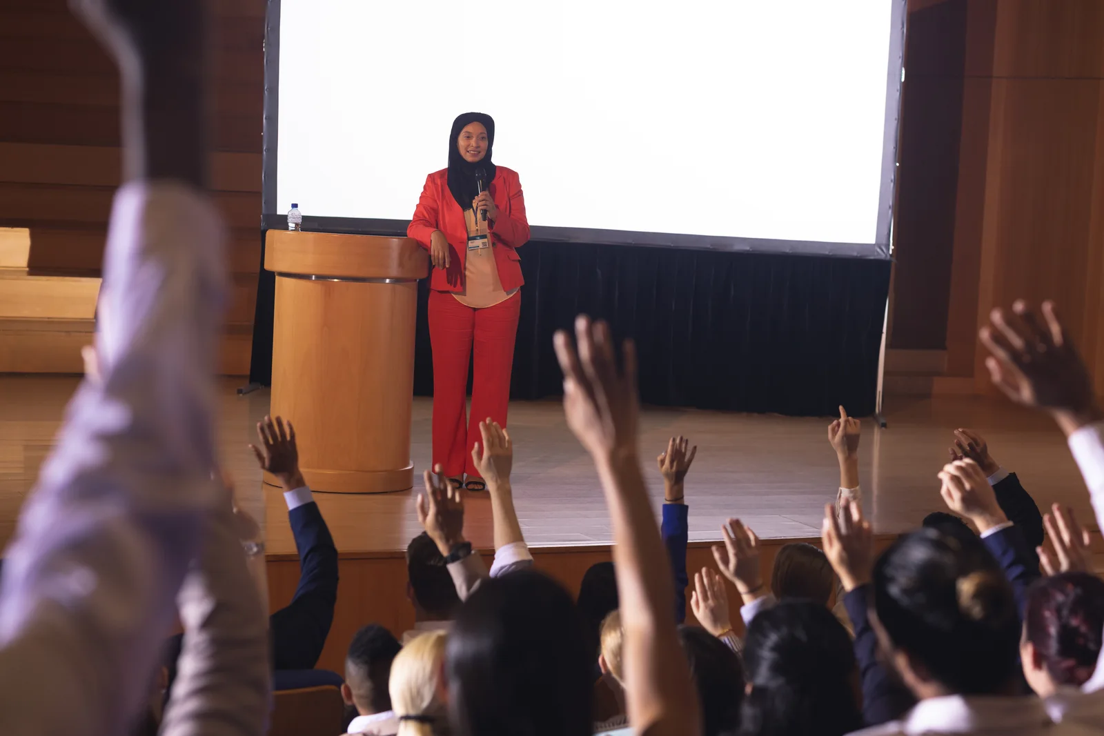 A professional presenting to an audience